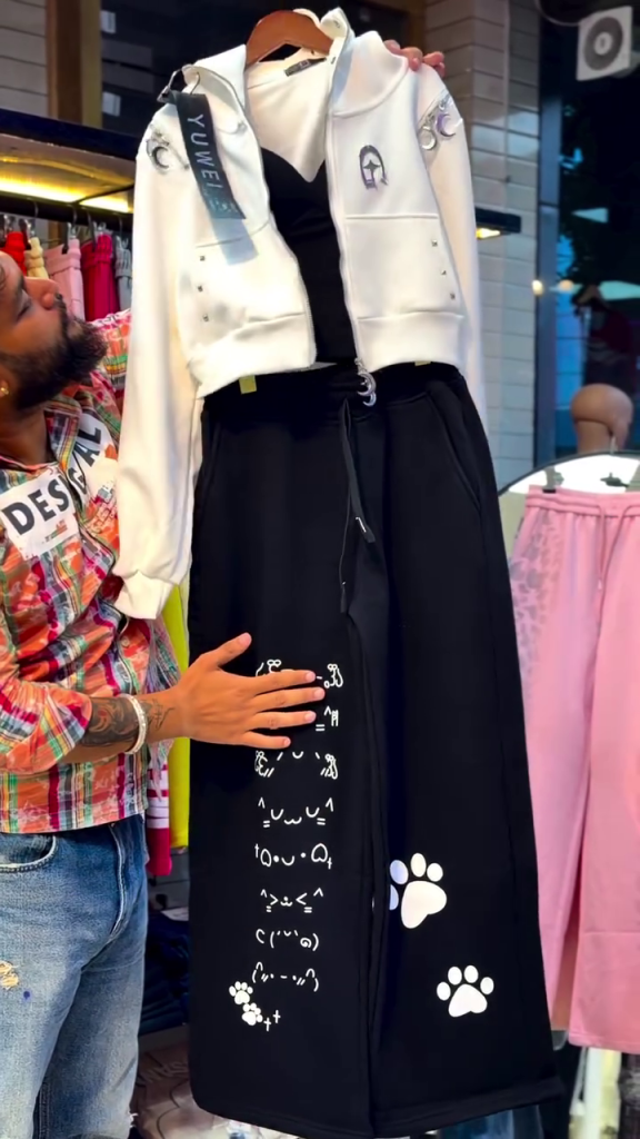 Women’s Trendy Black Casual Co-Ord Set with White Sleeveless Cropped Vest Jacket, Printed Cat & Paw Graphic Wide-Leg Trousers, Adjustable Drawstring Waist and Playful Streetwear Styling