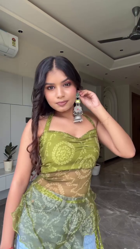 💚✨ Designer Olive Green Indo-Western Lehenga Set with Embellished Crop Blouse, Sheer Printed Dupatta-Style Overlay, Decorative Mirror-Style Border, Colourful Trim and Traditional Tassel Accents – Festive Party Wear Ensemble